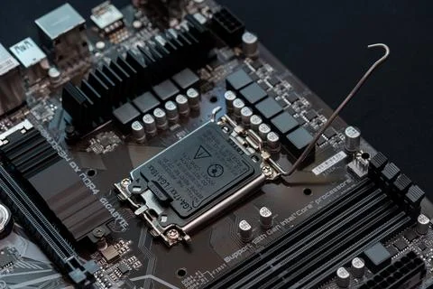 Opening, lifting the CPU socket lid LGA 17xx 18xx processor installation pr.. 写真素材