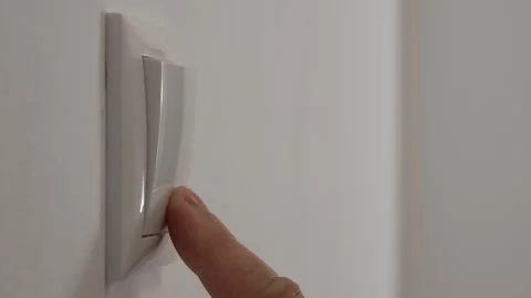 Opening the Light from the Switch in the Office. One Person Turning on the Light Stock Footage 321247348