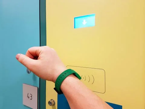 Opening the lock of the locker on personal items with the help of an impulse  Stock Photos