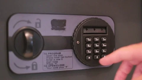 Opening locked vault. Man opening safety deposit box in hotel, hand typing Stock Footage 81543150