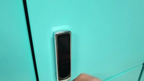 Opening the locker with an electro-magnetic bracelet. Stock Footage 208837984