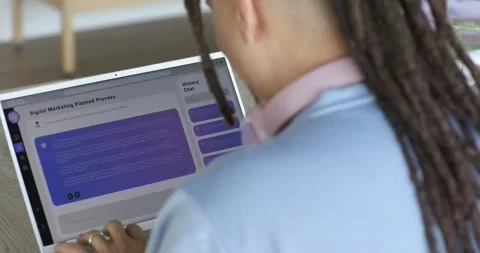 Opening marketing plan on laptop marketer scrolling suggestions and typing Stock Footage 339590857