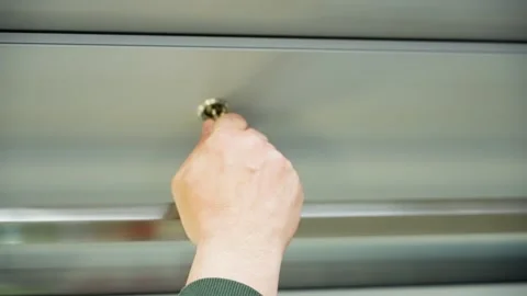 Opening a metallic drawer in a neutral kitchen setting Vidéo 343531616