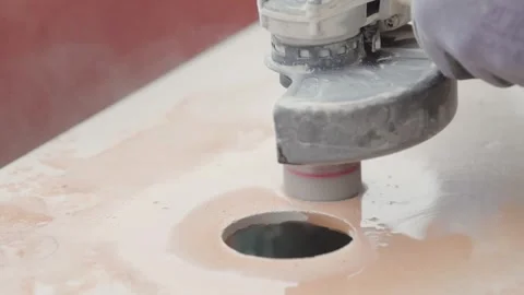 Opening multiple holes in a tile with a power tool. Tile construction worker Vídeo Stock 343083237