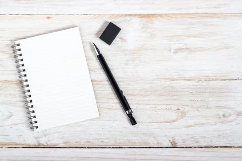 Opening note paper and pen on wood texture background with copy space Stock Photos