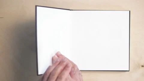 Two hands opening a book with blank page, Stock Video