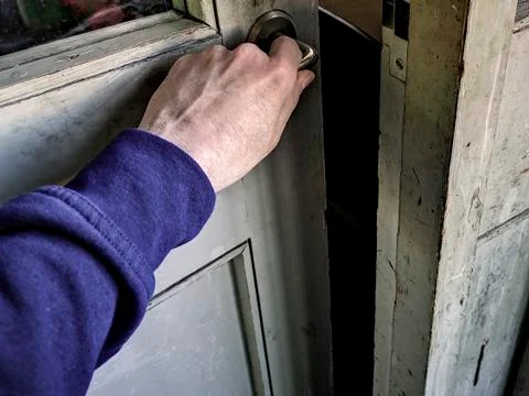 Opening an old door Stock Photos