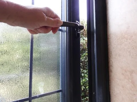 Opening or closing a window Stock Photos