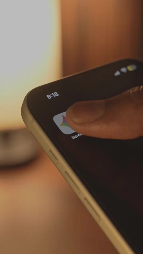 Opening or launching the Gemini ai app on a smartphone Stock Footage 333282566