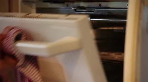 Opening an oven door. Stock Footage 45494503