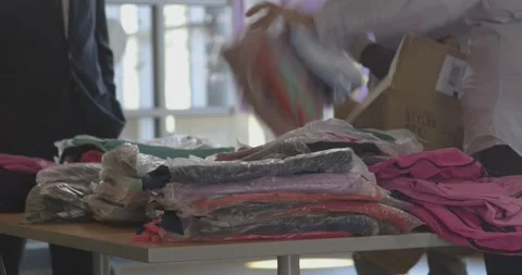 Opening packages, backpacks on table Stock Footage 304370001