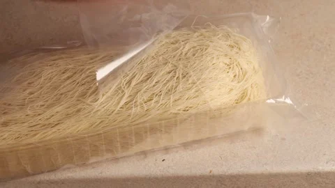 Opening packaging of kataifi dough. Close-up Stock Footage 295149150