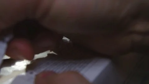 Opening of packing with a cartridge Stock Footage 81139094