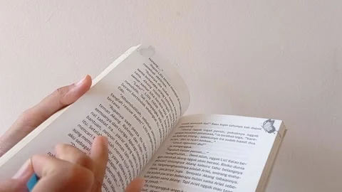 Opening a page of a book with a white background Stock Footage 145462214
