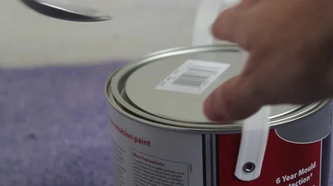 Opening a paint tin Stock Footage