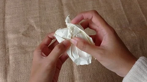 Opening the paper to look the content Stock Footage 151022804