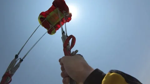 Opening a parachute Stockbeeldmateriaal 243149157