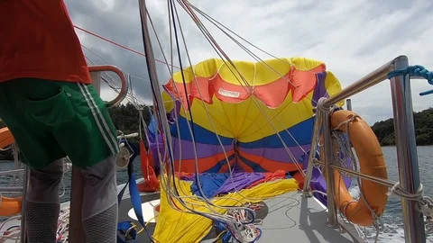Opening a parasail slow motion Stock Footage 91717264