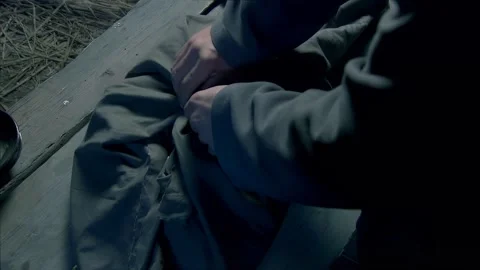 Opening the parcel and see darts and short knife Stock Footage 302952609