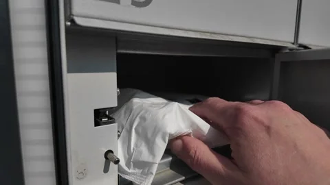 Opening the pick-up point box. Taking the parcel out of the pick up point box Video stock 305416219