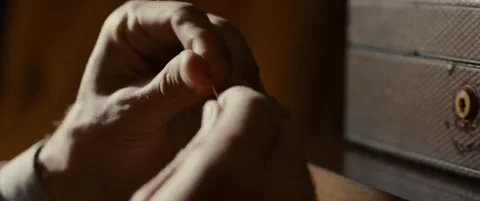 Opening pin using hands Stock Footage 155550974