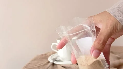 Opening the plastic of coffee powder Stock Footage 146250562
