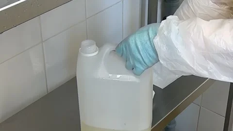Opening a Plastic Container in a Laboratory Setting for Experiment Stock Footage 320138395