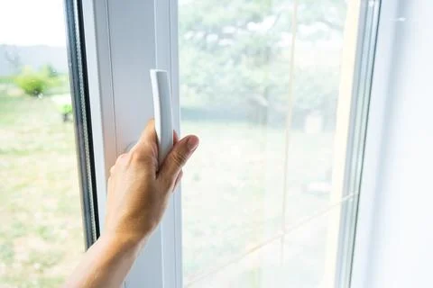 Opening plastic window, turning handle, hardware operation, important for r.. Stock Photos