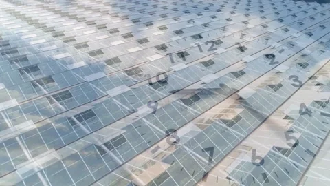 Opening reveal starting pan, solar panels glinting, showing moving shadows, Stock Footage 328657149