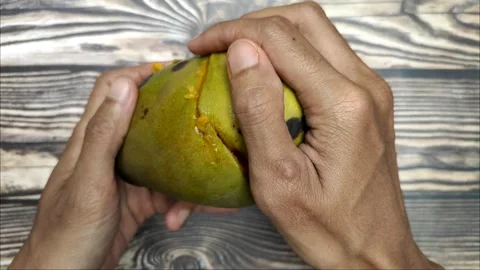 Opening A Ripe Fresh Mango Stock Footage 322007466