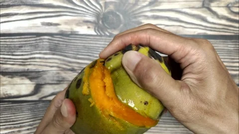Opening A Ripe Fresh Mango Stock Footage 322007477