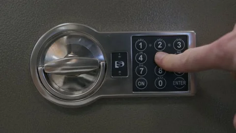 Opening a safe with a digital lock close-up Stock Footage 237346798