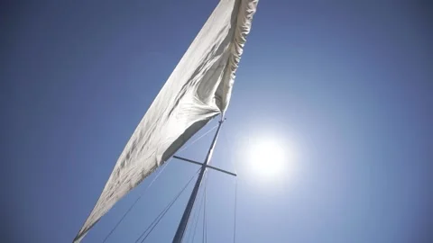 Opening the sail while sailing on a sailing luxury yacht at sea on a sunny day Vídeos de archivo 159367004