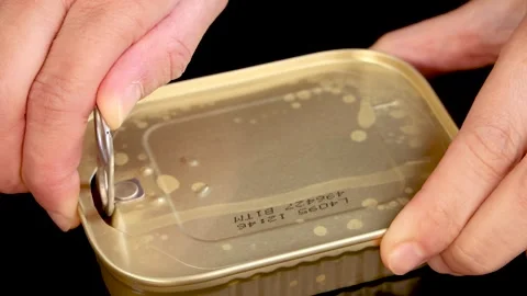 Opening a Sardine Can with Pull Tab in Close-Up Sequence Video stock 314031576
