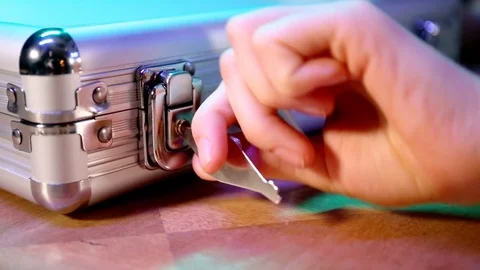 Opening silver suitcase with set for poker game. Stock Footage 125278863