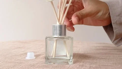 Opening a small bottle for a vase of flower Stock Footage 146256133