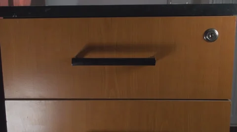 Opening A Small Cabinet And Putting Documents In, Office, Business, Front Shot Stock Footage 37331239