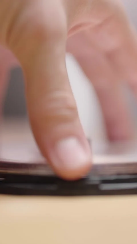 Opening a small cake of empty DVD or CD media packaging Stock Footage 324967477