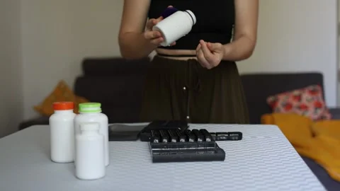 Opening supplement bottle for daily intake Stock-Footage 339096235