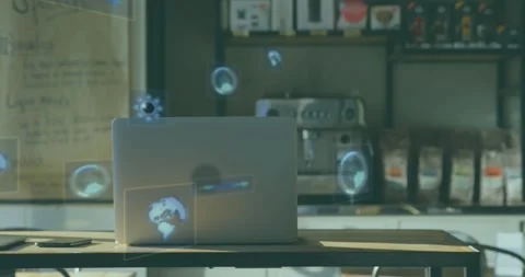 Opening on table silver laptop hosting holographic circles orbiting suggesting 库存影片 329569220