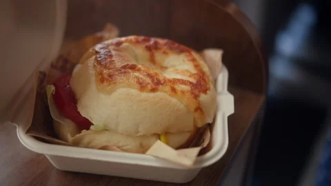 Opening Takeout Box and Taking Out Fresh Homemade Burger. Close-up of hands 스톡 동영상 340836010