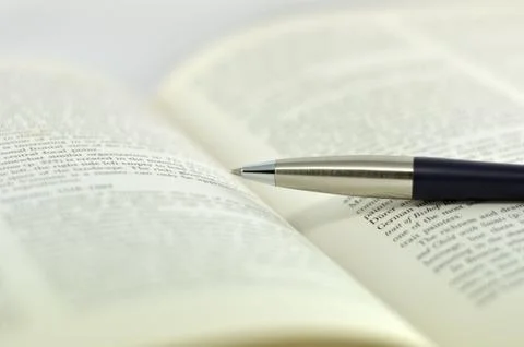 Opening textbook on white background Stock Photos