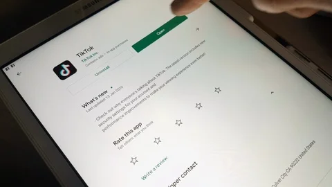 Opening Tiktok app from Google App Store on A Tablet Usa 2019 Stock Footage 123076284