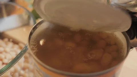 Opening a Tin Can with a Can Opener Stock Footage 77560168