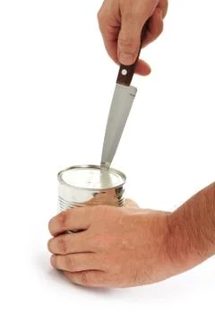 Opening tin Stock-Fotos