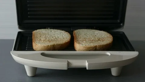 Opening toaster machine with two slices of bread inside, zoom in Stock Footage 72559685