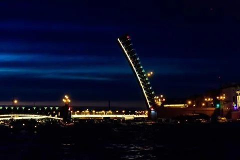 Opening of Trinity drawbridge. Night view of Trinity bridge from the Neva river Stock Photos