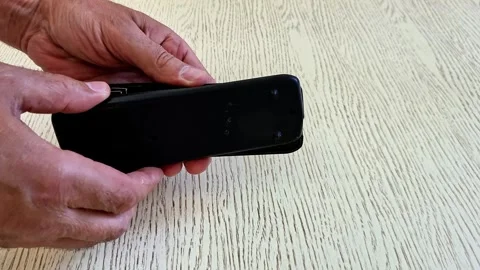 Opening TV Remote Control for Internal Repair and Maintenance Stock Footage 340746795