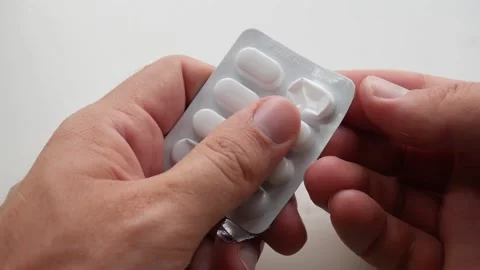 Opening an unbranded pack of tablets Stock Footage 205066730