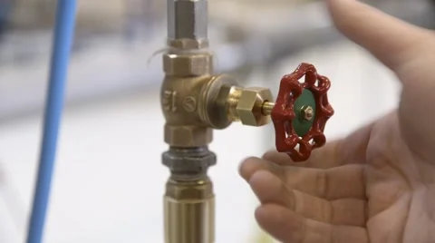 Opening valve in pipeline Stock Footage 60443039